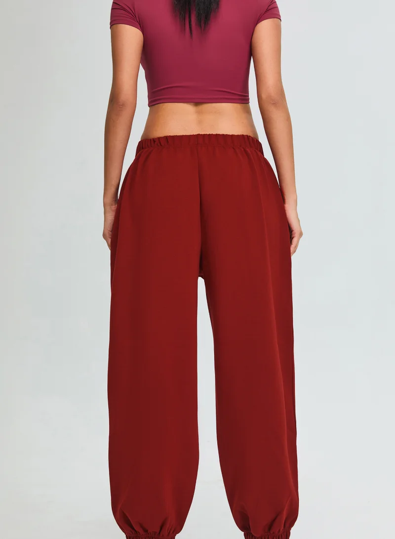 Kawn.yoga Crimson Red Mid Waist Oversized Joggers for Women | Best Price UAE